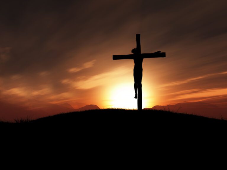 yesus disalip dengan background matahari terbenam